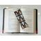 this guitar book mark is on top of an open book