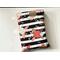 this floral book sleeve has a black & white stripe background. the flowers and leaves are in colors gold, light blue, and pink