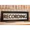 black wood recording studio LED light up lightbox and lamp sitting on desk for home studio, podcasters, musicians, and gamers