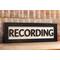 black wood recording studio LED light up lightbox and lamp sitting on desk for home studio, podcasters, musicians, and gamers