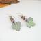 Super cute autumn earrings. Celebrate fall with these sweet dangles which have three teeny tiny copper enamel pumpkins of pastel green, orange, and lavender, with a pale green leaf swinging below. Super lightweight, slightly elegant yet easily blends with any attire.