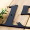 Close up of matte black powder coat on our metal address sign.