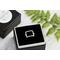 Sterling silver ring with open square design.
