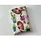 this western book sleeve has a light brown background with cowboy hats, boots, cacti & bulls all over the book protector