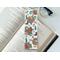 this western bookmark has a light brown with brown circles in the background. 