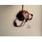Beagle ornament hanging on a wall.