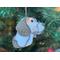 Close up of Beagle ornament hanging in a Christmas tree.