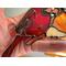 Close up of copper wire branch on Cardinal Ornament.
