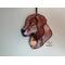 Golden Retriever Ornament hanging on a wall.