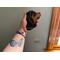 Rottweiler Ornament being held for size reference.