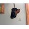 Rottweiler Ornament hanging on a wall.