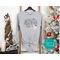 Monochromatic Long-Sleeve Believe Christmas Shirt: Minimalist Holiday Style for Festive Winter Days