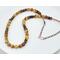 necklace features golden and brown banded tiger eye beads with copper accent rondelle beads, copper tubing and copper chain with hook clasp