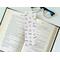 this bookish laminated bookmark is in a real life setting
