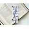 This French bookmark has a white background with the Eiffel Towers, some food all in black. And in colors blue and red is the words Paris and Bonjour