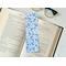 blue bookmark light blue background with different shades of blue flowers, leaves, and polka dots
