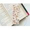 this rustic floral bookmark has a rustic brown background with rustic flowers and leaves with brown blocks