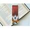 this skull bookmark has a ombre red background with lightning coming the sky and there is a crack on the right side. on the bottom there is a skull with wings coming out from a smoking flame