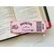 This bookmark looks like a ticket in color dark and light pink. In the center says 'Booktok Community,' 'Lifetime Member' with book with flowers coming out of the book on the left and a book with flowers coming out by the word Community. there are boarders at each corner. Under the bar code the words 'ADMIT ONE'