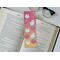 this cute ghost bookmark has ghosts and disco balls over the book mark