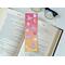This witch bookmark has witches hats, brooms, bats, moons. all over the book mark