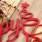 Close up of red gloss powder coat on our Happy Holidays metal wall art.