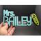Base Black.  Top Lettering Color Teal.  Emoji Pencil in Yellow.