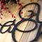 Close up of matte black powder coat on our Unto Us A Child Is Born metal sign.