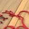 Close up of red powder coat on our Peace on Earth metal wall art.