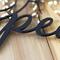 Close up of matte black powder coat on our peace doves metal wall decor.