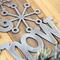 Close up of raw steel on our Let it Snow metal wall art.