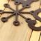 Close up of copper vein powder coat on our Let it Snow metal wall art.
