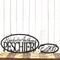 Oval sign with first names and family last name, along with an established year metal sign, in matte black powder coat.