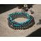 western look bracelets. 3 in a stack, sold as one. metal beads ns turquoise blue stone. stretchy.