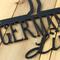 Close up of matte black powder coat on our German Shepherds Live Here metal wall art.