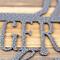 Close up of silver vein powder coat on our German Shepherds Live Here metal wall art.