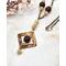 square washer style flame colored copper pendant with purple quartz and cream colored crystal beads on copper chain with hook clasp