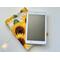the ereader is on top of the kindle sleeve on a white table with fairy lights on the left side