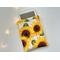 a ereader is peeking out of the flower cover