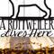 Close up of A Rottweiler Lives Here wording on our Rottweiler metal wall art, in matte black powder coat.