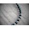 closeup of spiral knot in black stainless steel beads, black glass seed beads