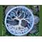 3 inch tree of life sits in bed of moss atop river rock 