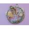 front view pink backgroundfront facing wire tree leaning against river rock and quartz