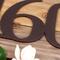 Close up of copper vein powder coat on our metal house number sign.