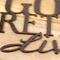 Close up of copper vein powder coat on our Golden Retrievers Live Here metal plaque.