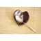 Ceramic heart shaped spoon rest. Glazed in dark purple and cream color. Approximately 3"x3.5"