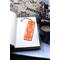 Front of bookmark with orange background, hand painted paw prints and various dot art designs in white. Jute rope tassel.