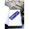 Front of bookmark royal blue background, handwritten lettering in white, starfish and turtles.  Jute rope for tassel.