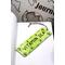 Front of bookmark, lime green background, black handwritten lettering, turtles, starfish and jute rope tassel.
