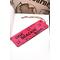 Front of bookmark hot pink background, black handwritten lettering, turtles, starfish, various dot art.  Jute rope tassel.